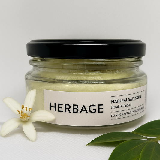 Jar of Herbage Natural Salt Scrub with a black lid on a white background