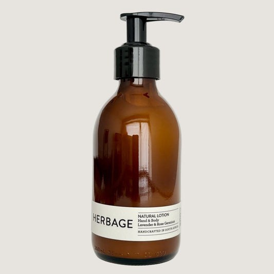 Brown lotion bottle with pump and white label on a light gray background